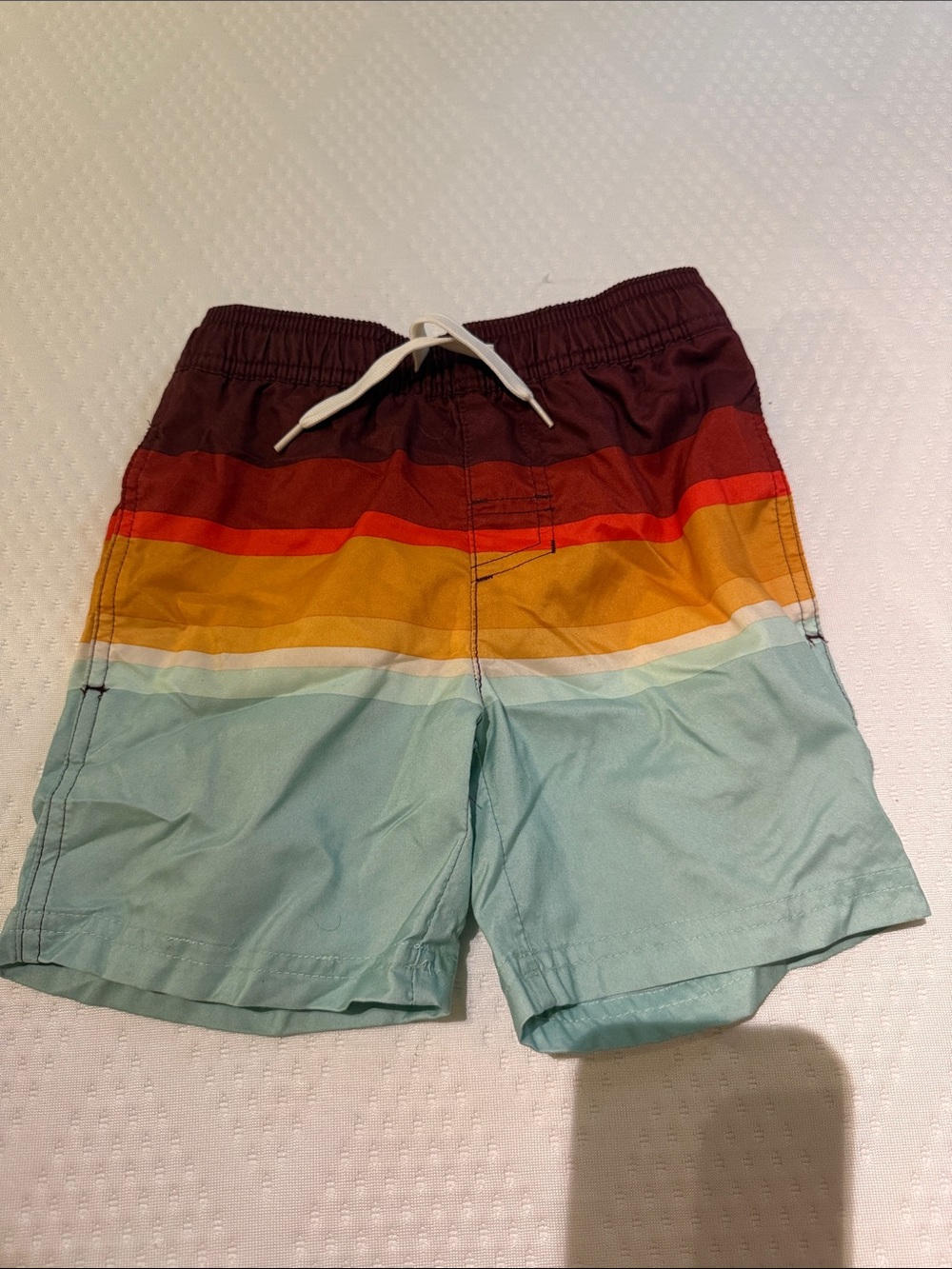 Boys XS multi-colored swim trunks